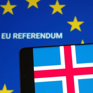 An illustration shows the Icelandic flag on a smartphone in front of the European Union flag and the words EU REFERENDUM on a screen in Palermo, Italy, on August 30, 2026. 