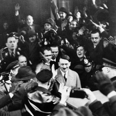 Followers of the Nationalist Socialist Party cheer their leader Adolf Hitler, as he left the Hotel Kaiserhof in Berlin, Jan. 30, 1933 following his appointment by President Von Hindenburg as Chancellor of Germany.