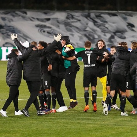 Mönchengladbach players are celebrate to have made it through the group stage after UEFA Champions League Group stage Group B match between Real Madrid CF 2-0 Borussia Mönchengladbach