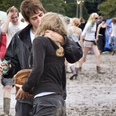 Picture made available on 04 July 2007 shows unidentified youths standing in mud in the camping area of the Roskilde Festival, some 30 kilometres west of Copenhagen,