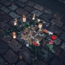 Kerzen und Blumen liegen um eine Ansammlung von sieben Stolpersteinen herum.