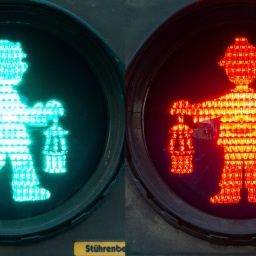 Ein Bergmann ist als grüne sund rotes Ampelmännchen zu sehen.