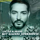 Gianni Jovanoic ist Gast in dieser Podcast-Ausgabe. Auf dem Bild schaut er in die Kamera.