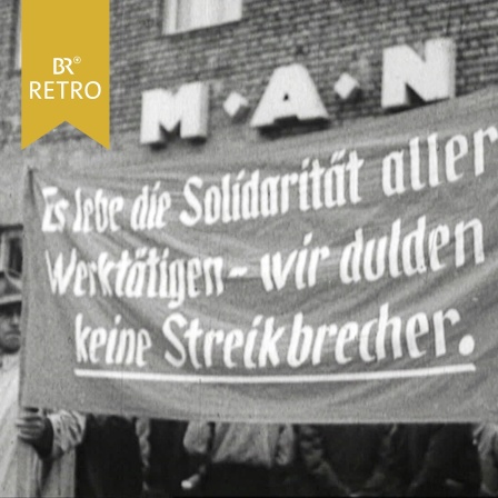 Transparent mit der Aufschrift "Es lebe die Solidarität aller Werktätigen - wir dulden keine Streikbrecher" vor dem MAN Gelände in Augsburg   | Bild: BR Archiv