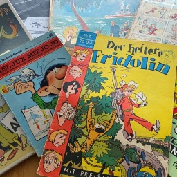 Comics von Spirou-Macher André Franquin liegen auf dem Tisch