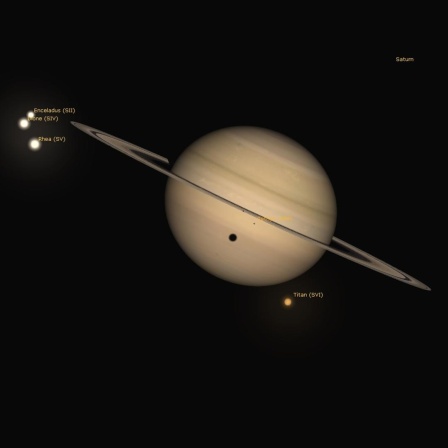 Der Schatten des Mondes Titan (rechts unterhalb) fällt für einige Stunden auf den Gasriesen Saturn.