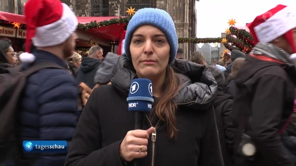 Tagesschau - Cosima Gil, Wdr, Zur Stimmung Und Sicherheit Auf Dem Weihnachtsmarkt Vor Dem Kölner Dom