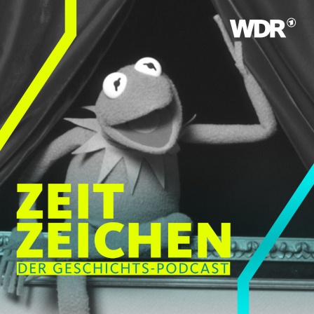 Kermit der Frosch öffnet den roten Vorhang eines Theaters