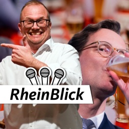 Jochen Ott (SPD) und Henrdik Wüst (CDU) mit Bier auf dem politischen Aschermittwoch
