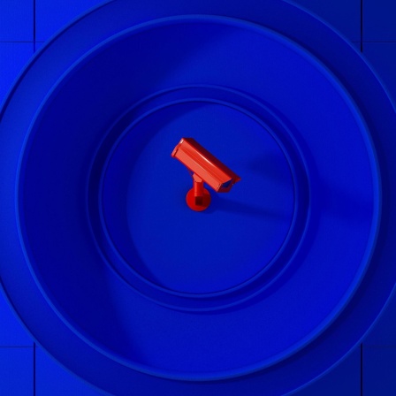 Eine rote Überwachungskamera innerhalb eines blauen Kreises.