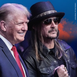 Kid Rock pose for photographs with former President Donald Trump at the UFC 295 mixed martial arts event.