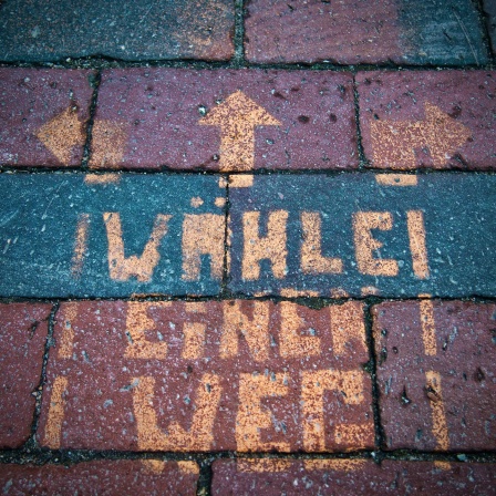 Spruch auf dem Asphalt