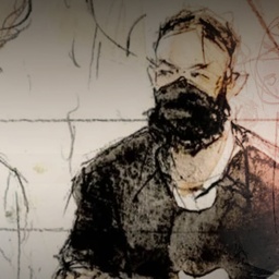 Eingangstüre von Bataclan mit Polizist und Blumensträuße