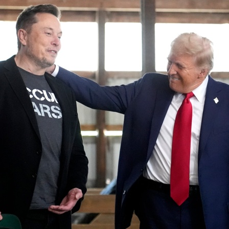 Tesla und SpaceX CEO Elon Musk, links, und designierter US- Präsident Donald Trump 
