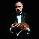 Marlon Brando als Don Vito Corleone mit einer Katze auf dem Arm