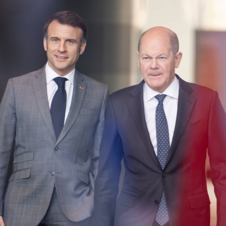 Frankreichs Präsident Emmanuel Macron (l) und Bundeskanzler Olaf Scholz (r). Archivbild: 15.03.2024