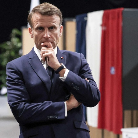 Der Französische Präsident Macron in einer nachdenklichen Pose
