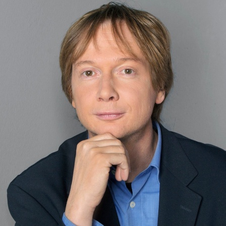 Ein Porträtbild von Holger Beckmann.