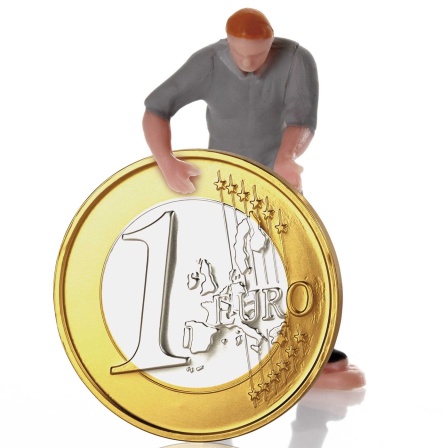 Spielfigur mit Euromünze