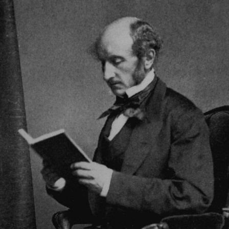 Porträt von John Stuart Mill (1806-1873). Er sitzt in einem Stuhl in liest ein Buch.