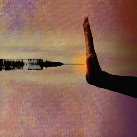 Hand verweigert eine Impfung (Illustration)