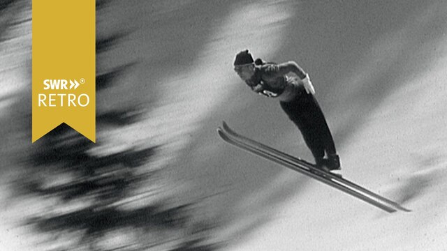 Sportler bei Ski-Springen