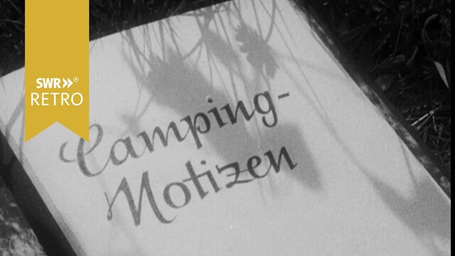 Notizbuch mit Aufschrift "Camping Notizen"