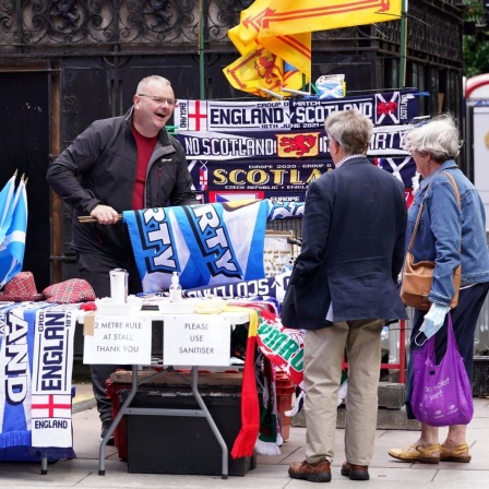 Scotland Fans - Glasgow A stall holder on Buchanan Street, Glasgow, selling Tartan Army flags and scarves to Scotland football fans ahead of the UEFA EURO, EM, Europameisterschaft,Fussball 2020 Group D match between England and Scotland at Wembley Stadium
