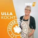 Ulla in Kochschürze, lachend