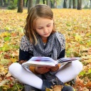 young girl reads a book in the autumn park ,model released, Symbolfoto PUBLICATIONxINxGERxSUIxAUTxONLY Copyright: xalexmakx Panthermedia15821071