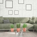 Home-Stageln modernisierung Inneneinrichtungen. Das Bild zeigt ein Wohnzimmer mit einem grünen Sofa.