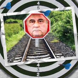 Eine Fotomontage zeigt eine Stoppschild mit dem Gesicht von GDL-Chef Claus Weselsky, das mitten im Gleisbett steht. 