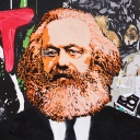 Berlin: Ein Bild von Karl Marx als Streertart auf einer Mauer. © Wolfram Steinberg/dpa