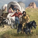 Siedler mit Planwagen und zu Pferd