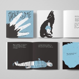 Die Fotografie zeigt den Titel und einige Doppelseiten aus der Graphic Novel "The Wolf and me", unter anderem eine junge Frau, die von der Silhouette eines Wolfes umschlungen wird.