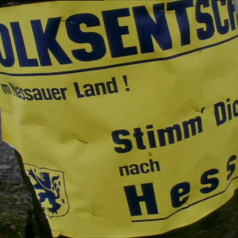 Wahlplakat mit der Aufforderung: &#034;Stimm Dich heim nach Hessen!&#034;