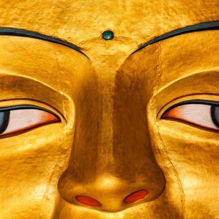 Die Augen einer Buddha-Figur.