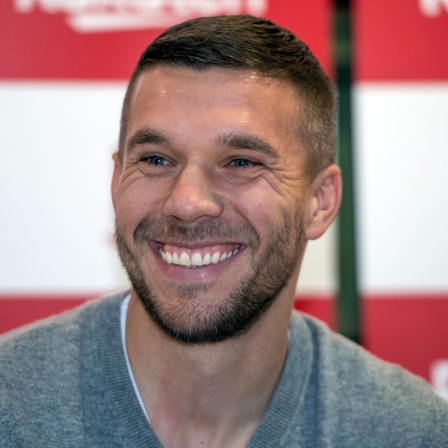 Lukas Podolski lächelt