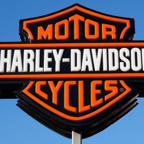 Schild mit Werbung für "Harley-Davidson Motor Cycles"